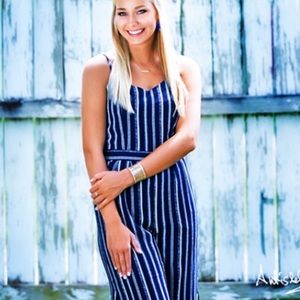 Woman’s navy and white striped jumpsuit